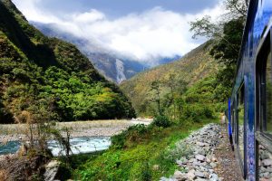 Peruvian train to Machu Picchu passes along the Urubamba River.