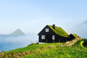 Black,Wooden,Faroese,House,With,Turf-top,Grass,Roof,In,The