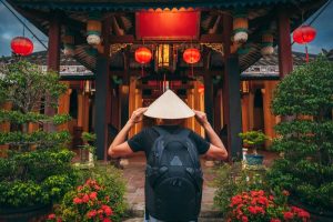 Back,Of,A,Male,Tourist,In,A,Vietnamese,Hat,At
